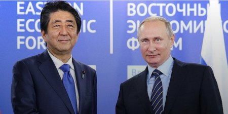 Премьер Японии предложил Путину "поставить точку" в ненормальных отношениях между странами